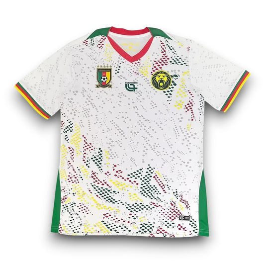 GOATkitz Cameroon 2026 adult away jersey, white with green and red trim, featuring a lion emblem and national crest.