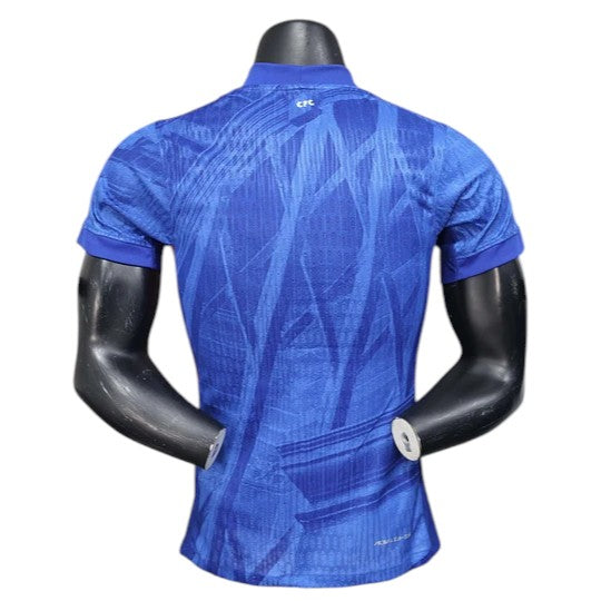 GOATkitz Chelsea 2025-26 Adult Player Version Home Jersey, royal blue with abstract pattern, short sleeves, CFC logo on collar.