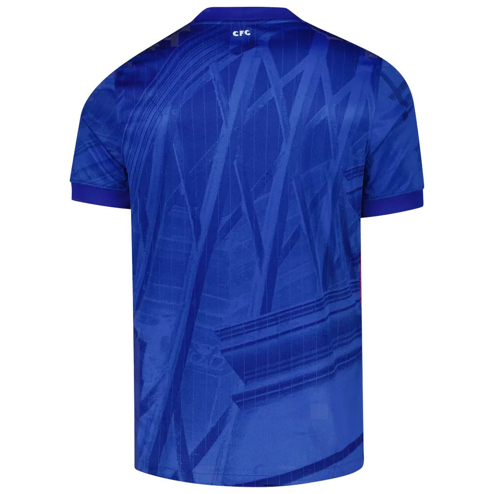GOATkitz Chelsea 2025-26 kids home jersey, royal blue with abstract pattern and CFC logo on back collar.