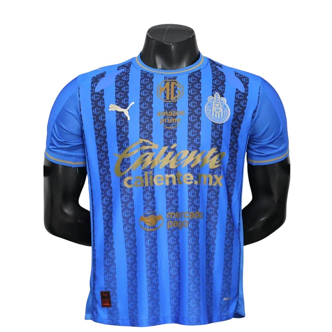 GOATkitz Chivas 2025-26 Player Version Away Jersey in blue with gold stripes and repeating pattern. Customizable.
