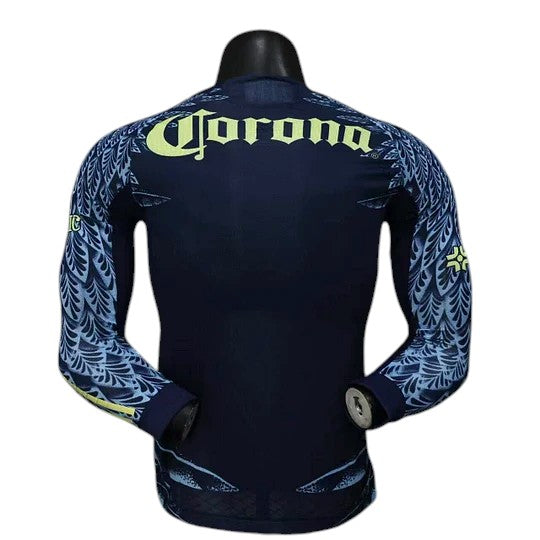 GOATkitz Club América 2025-26 long sleeve player version away jersey in navy blue with light blue feather-like accents on sleeves and hem.