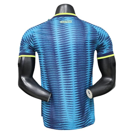 GOATkitz Colombia 2026 Player Version Away Jersey in blue with a geometric pattern and yellow trim. Customizable.