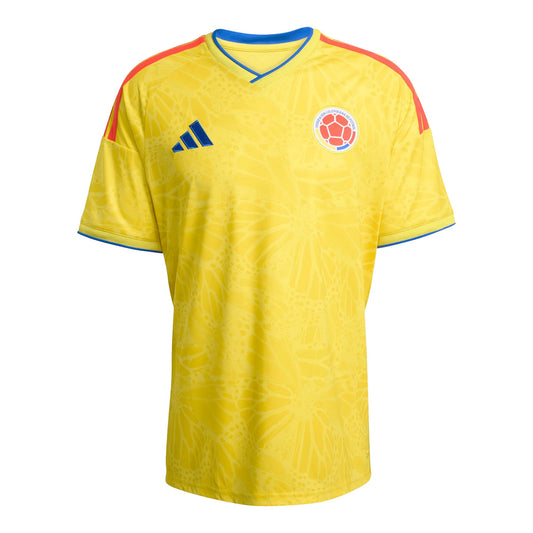 GOATkitz Colombia 2026 adult home jersey, yellow with blue and red accents, featuring a subtle butterfly pattern and official crest.