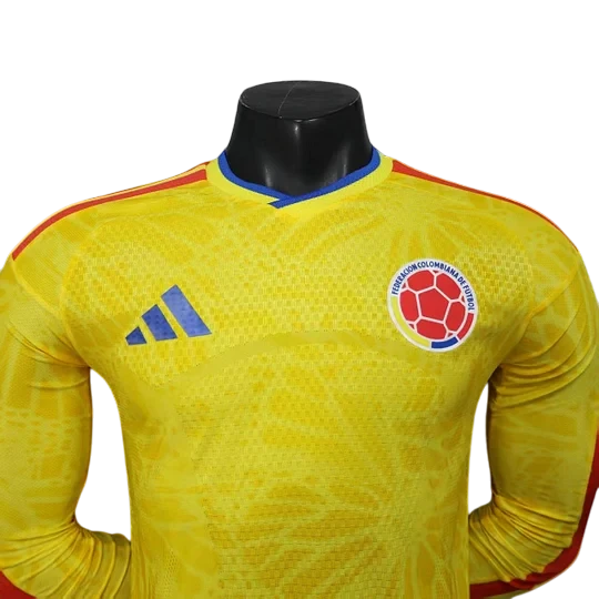 GOATkitz Colombia 2026 long sleeve player version home jersey in yellow with blue and red accents. Features Adidas logo and Colombian Football Federation crest.