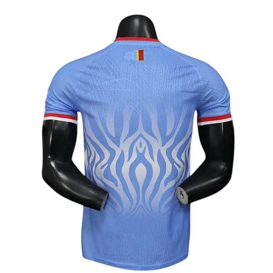 GOATkitz DR Congo 2026 player version home jersey in light blue with white flame pattern and red trim on collar and sleeves.