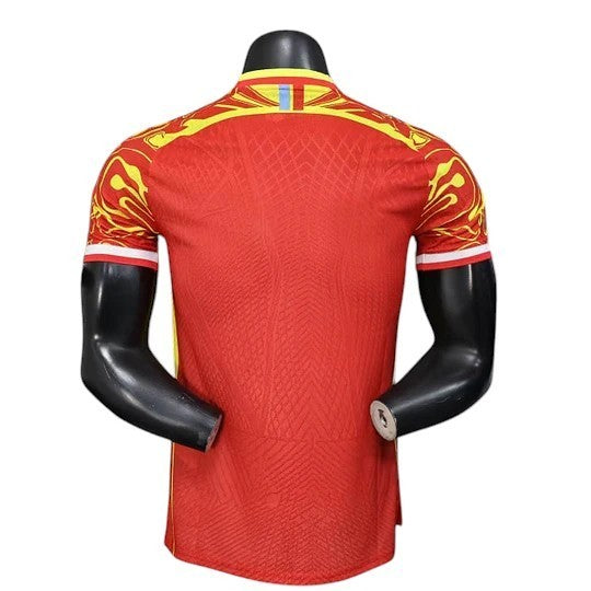 GOATkitz DR Congo 2026 Player Version Third Jersey, red with yellow accents on sleeves and collar, textured fabric.