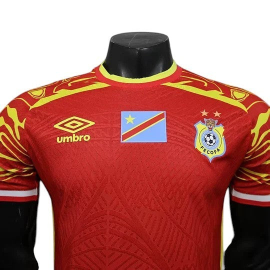 GOATkitz DR Congo 2026 player version third jersey in red with yellow accents, featuring the Umbro logo and national flag.