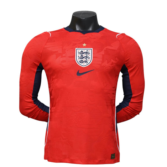 GOATkitz England 2026 player version long sleeve away jersey in red with navy blue accents and England crest.