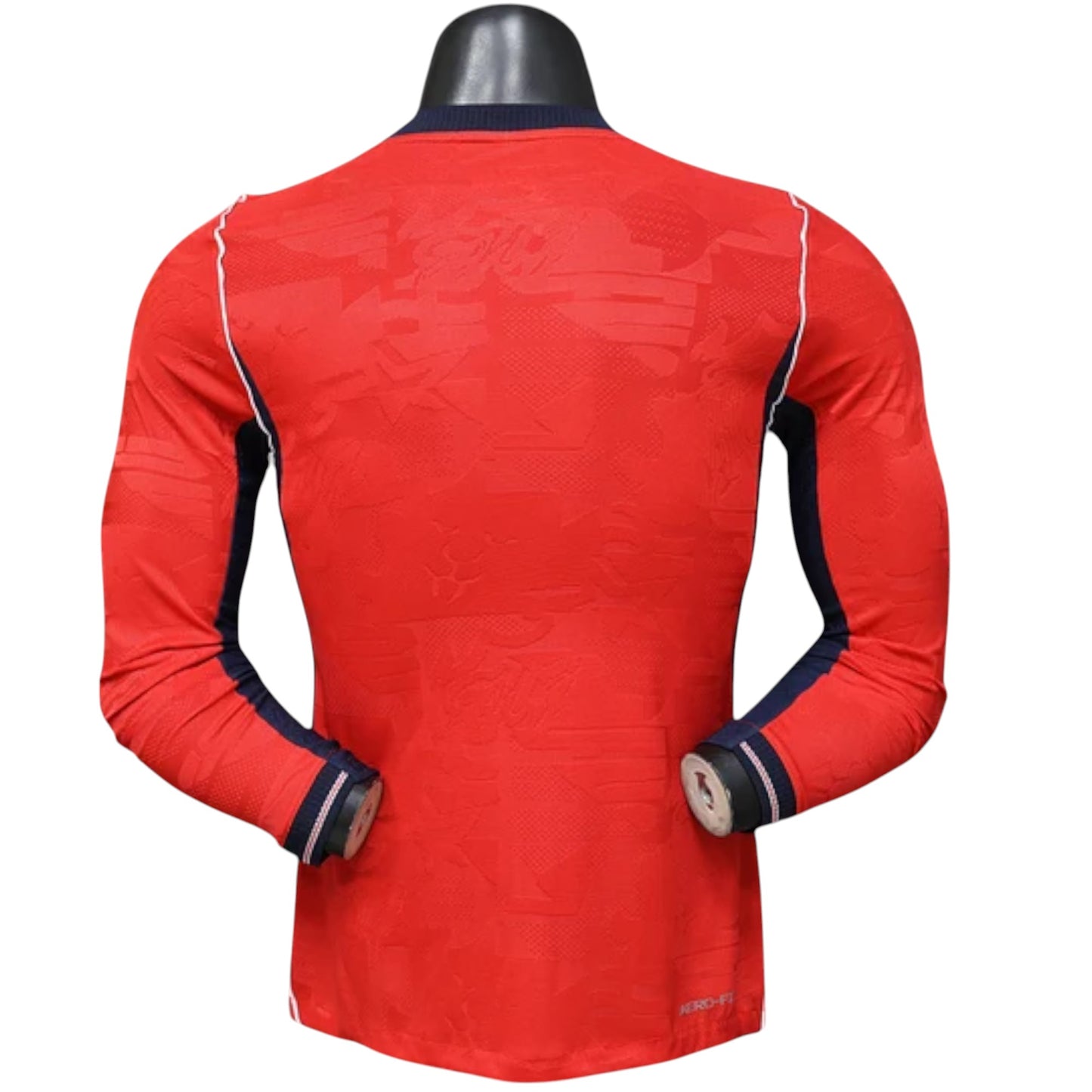 GOATkitz England 2026 player version away jersey, red long sleeve with navy blue accents and white piping. Textured fabric.