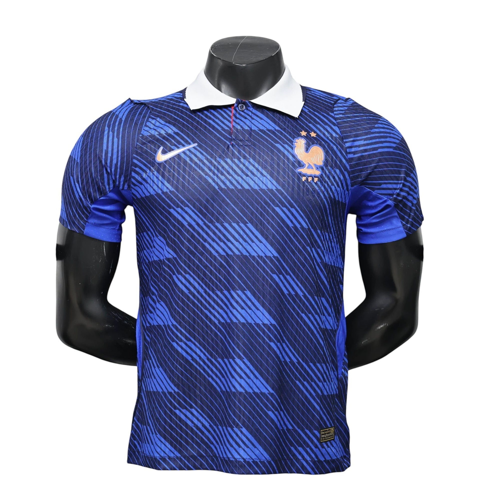 GOATkitz France 2026 player version home jersey in blue with white collar and dynamic stripe pattern. Features Nike logo and FFF crest.