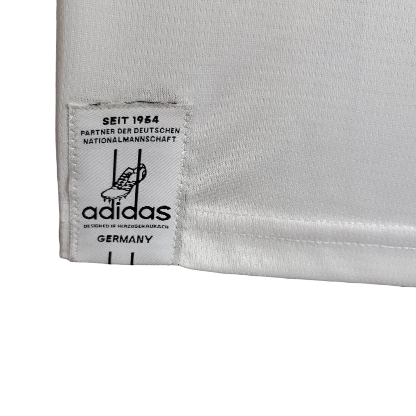 GOATkitz Germany 2026 white football jersey with Adidas logo and 'Seit 1954' detail.