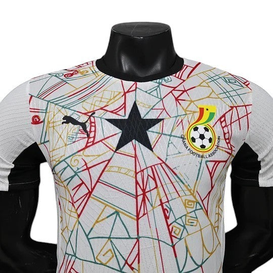 GOATkitz Ghana 2026 player version home jersey in white with black, red, and gold abstract pattern. Features a black star and Ghana Football Association crest.