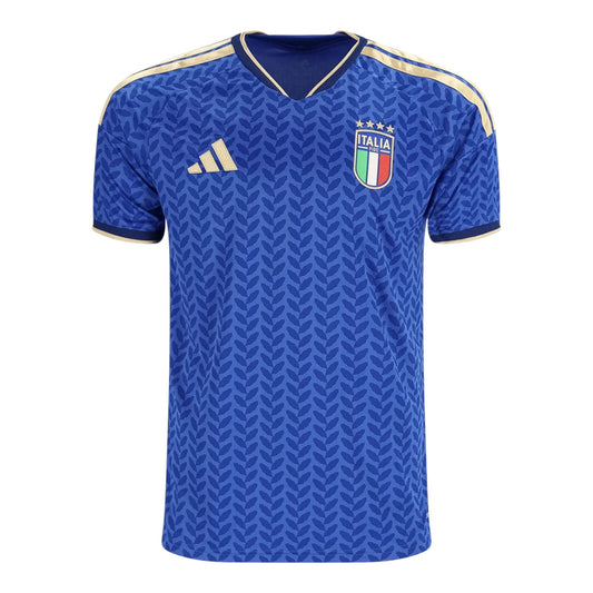 GOATkitz blue Italy 2026 kids home jersey with gold trim and leaf pattern. Features Italia crest and Adidas logo.