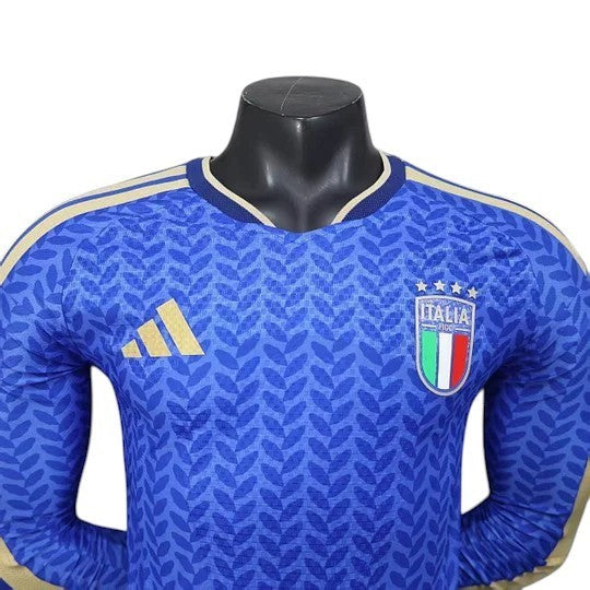GOATkitz Italy 2026 player version long sleeve jersey in blue with gold accents and leaf pattern. Features the Italian crest and Adidas logo.