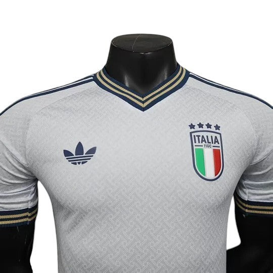 GOATkitz Italy 2026 player version away jersey in white with navy and gold trim. Features Adidas logo and Italia crest.
