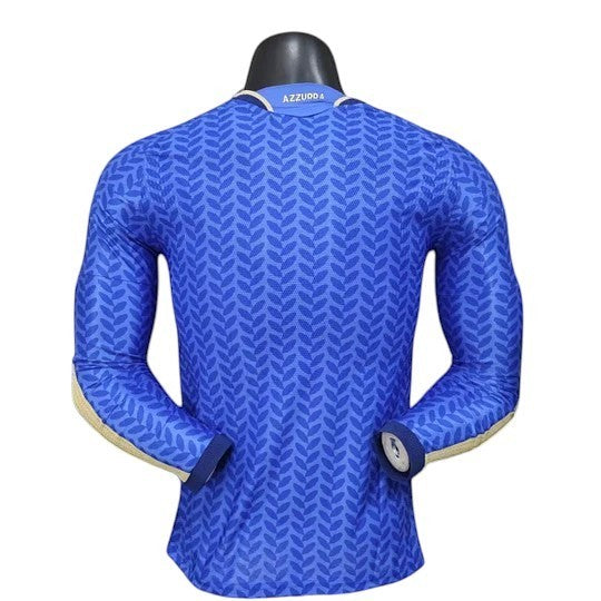 GOATkitz Italy 2026 long sleeve player version home jersey in royal blue with a subtle leaf pattern and gold accents on the sleeves.