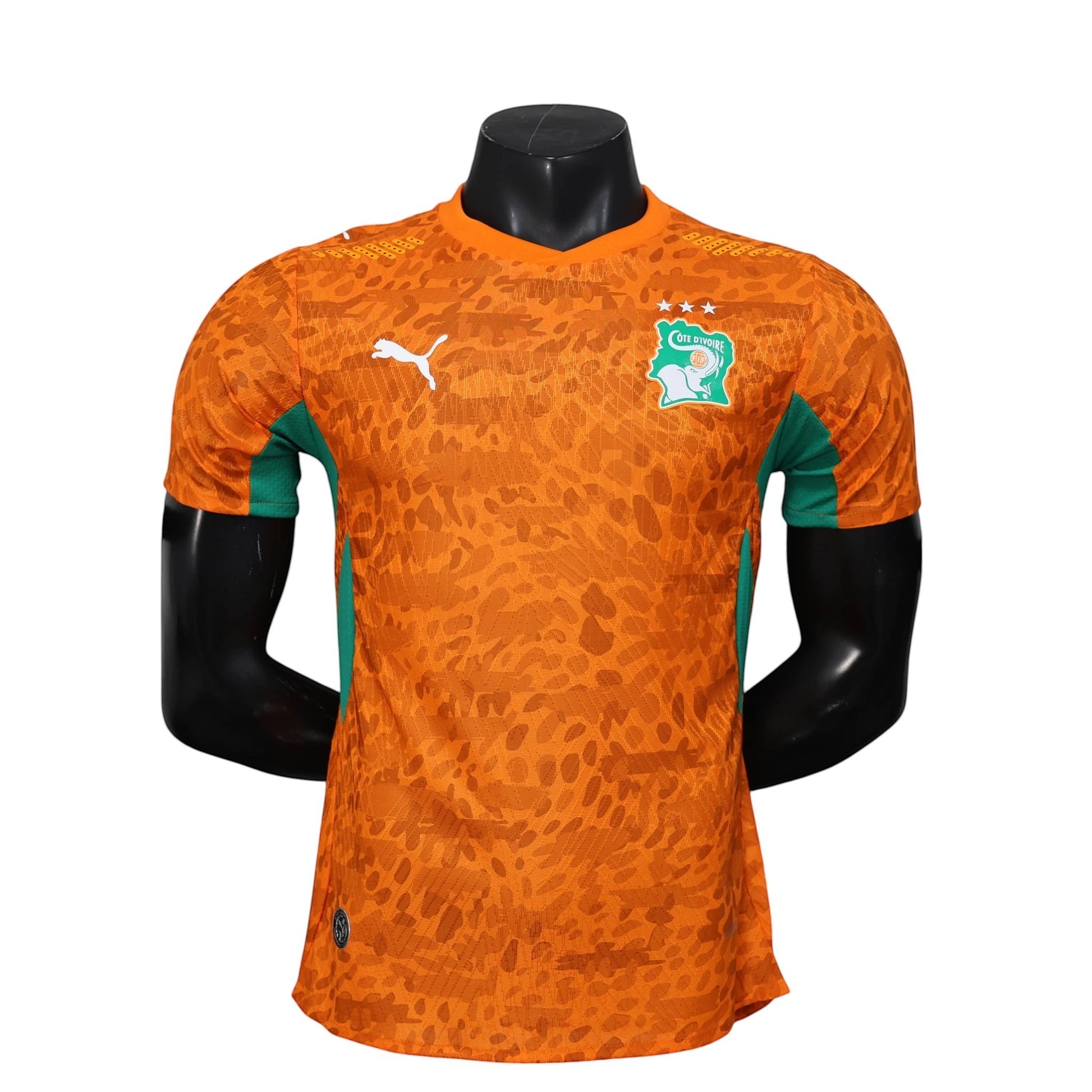 GOATkitz Ivory Coast 2026 player version orange soccer jersey with green accents and customisable badges.