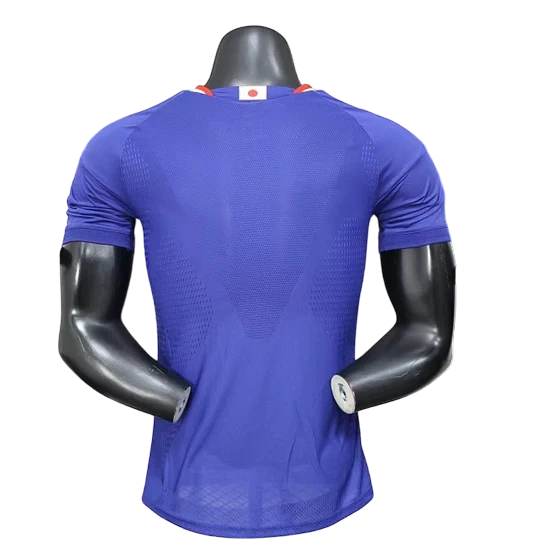 GOATkitz Japan 2026 player version home jersey, royal blue, short sleeves, crew neck, with Japanese flag detail on collar.