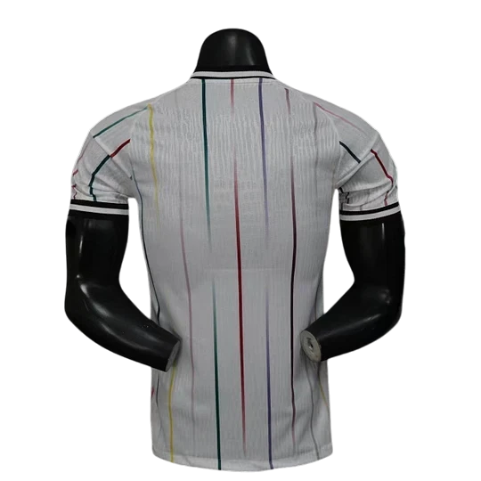 GOATkitz Japan 2026 Player Version Away Jersey, white with multi-colored vertical stripes and black trim on collar and sleeves.