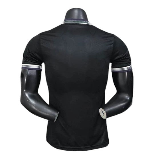 GOATkitz Juventus 2025-26 black player version third jersey with white and navy striped cuffs and collar.