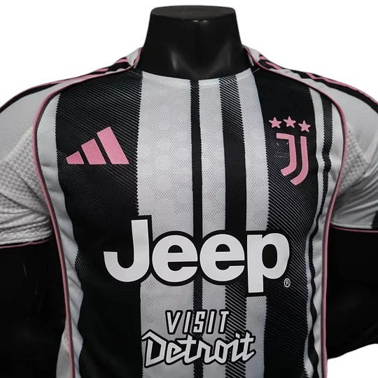 GOATkitz Juventus 2025-26 player version home jersey in black and white stripes with pink accents. Features Jeep sponsor logo.
