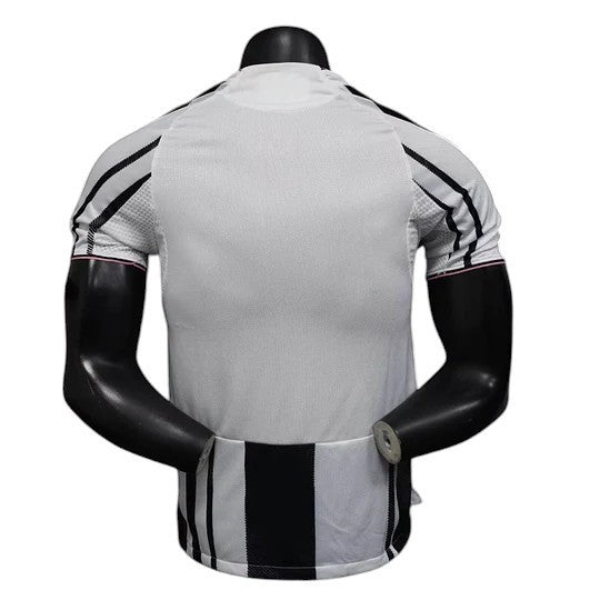 GOATkitz Juventus 2025-26 player version home jersey, white with black stripes and trim, customizable name and number.