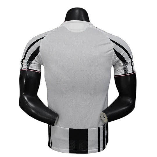 GOATkitz Juventus 2025-26 player version home jersey, white with black stripes on sleeves and hem, pink trim.