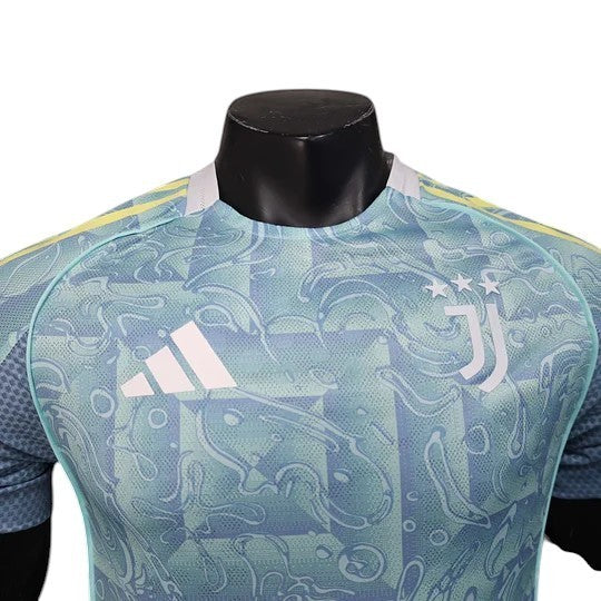 GOATkitz Juventus 2025-26 player version away jersey in light blue and yellow. Features a unique abstract pattern, Adidas logo, and Juventus crest.