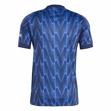 GOATkitz Arsenal 2025-26 kids away jersey, dark blue with a repeating geometric zig-zag pattern in lighter blue.