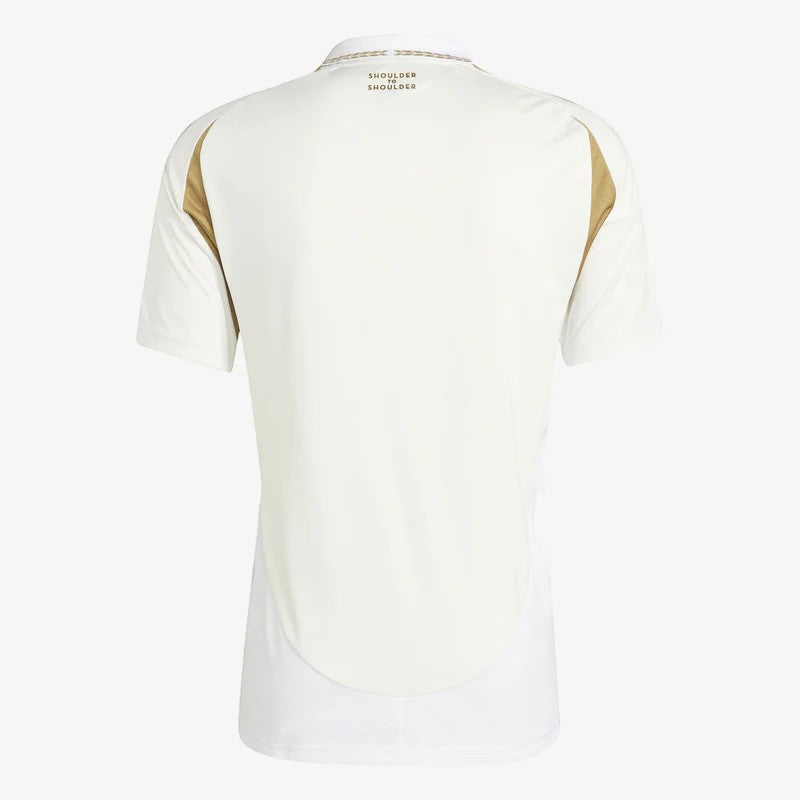 GOATkitz LAFC 2025-26 adult away jersey in off-white with gold accents on shoulders and collar. Features "Shoulder to Shoulder" text.