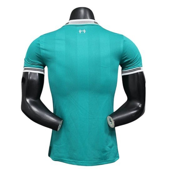 GOATkitz Liverpool 2025-26 Player Version Third Jersey in teal with white and black striped cuffs and collar.
