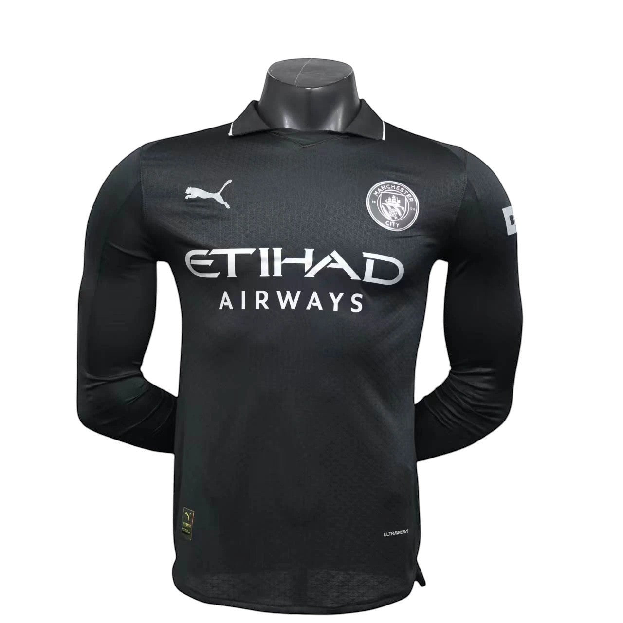 GOATkitz Manchester City 2025-26 black long sleeve player version jersey with Etihad Airways sponsor and club crest.