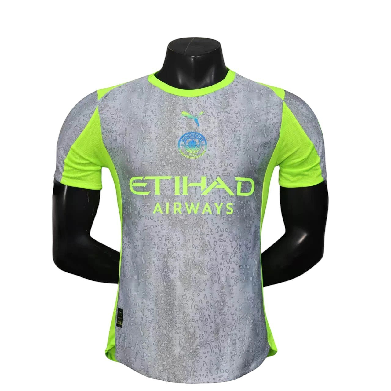 GOATkitz Manchester City 2025-26 player version third jersey in grey with lime green accents and a water droplet pattern.