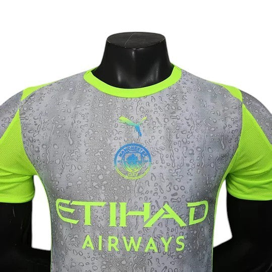 GOATkitz Manchester City 2025-26 player version third jersey in grey with neon green accents and a water droplet pattern.