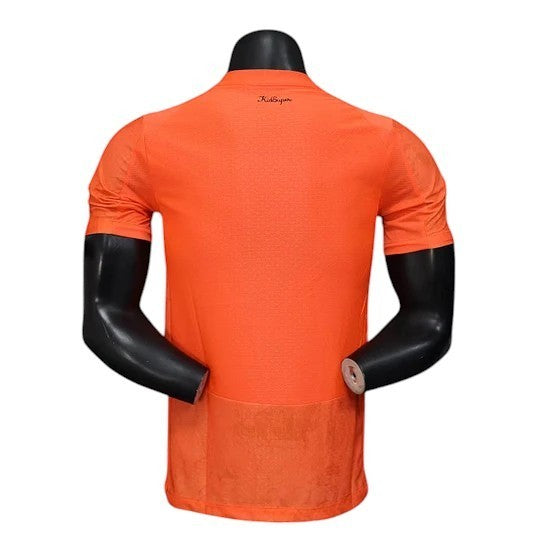 GOATkitz Manchester City x KidSuper orange player version jersey with customizable name and number. Lightweight, slim fit.