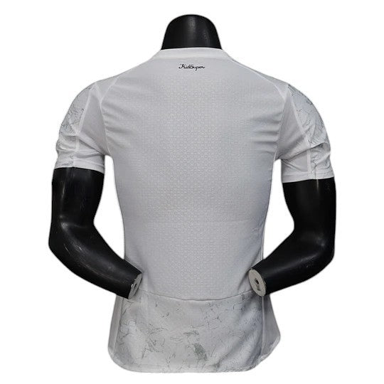 GOATkitz Manchester City x KidSuper 2025-26 player version jersey, white with grey marble pattern on sleeves and hem, crew neck.