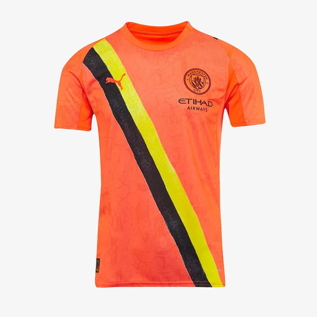 GOATkitz Manchester City x KidSuper orange kids jersey with black and yellow diagonal stripe and Puma logo. Customizable.