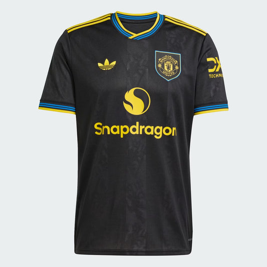 GOATkitz Manchester United 2025-26 black fan jersey with yellow and blue trim, featuring Snapdragon logo and team crest.
