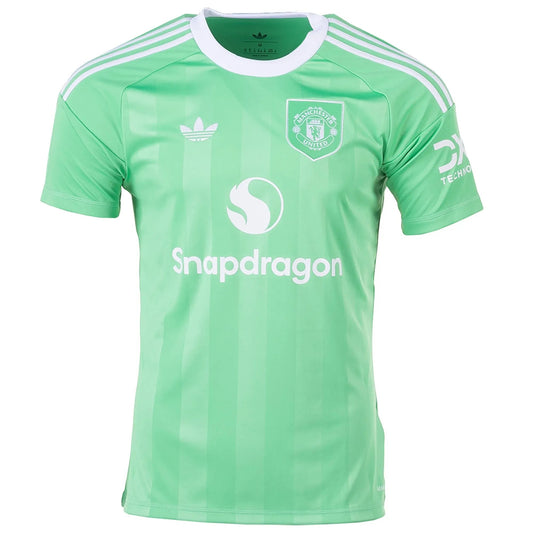 GOATkitz Manchester United 2025-26 green goalkeeper jersey with white Adidas stripes and Snapdragon logo.