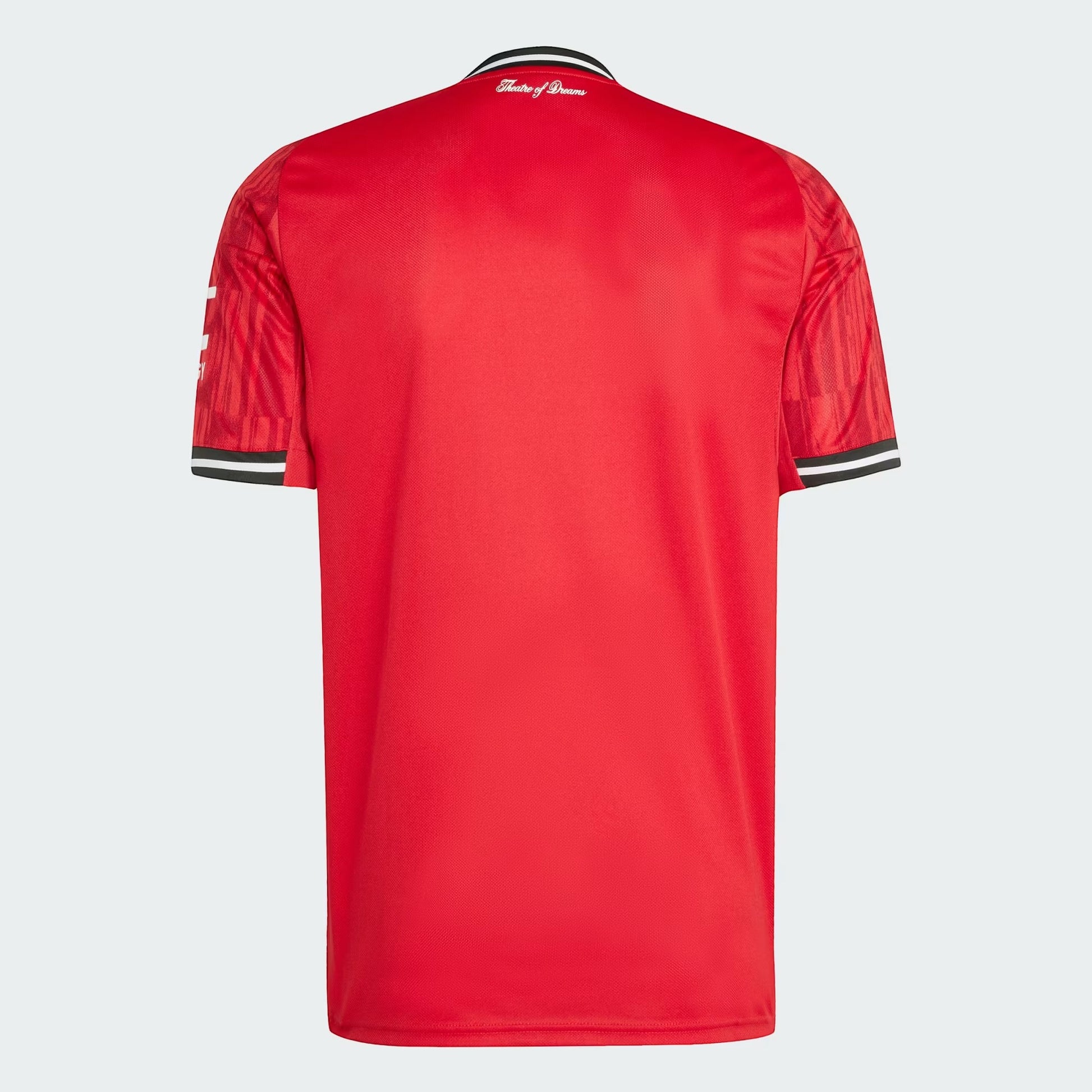 GOATkitz Manchester United 2025-26 kids home jersey in red with black and white striped collar and sleeve cuffs. Features 'Theatre of Dreams' text on the back.