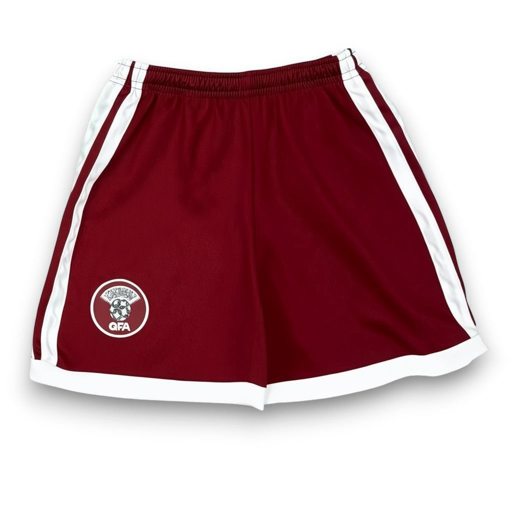 GOATkitz maroon kids soccer shorts with white trim and QFA logo. Customizable for Qatar 2026.