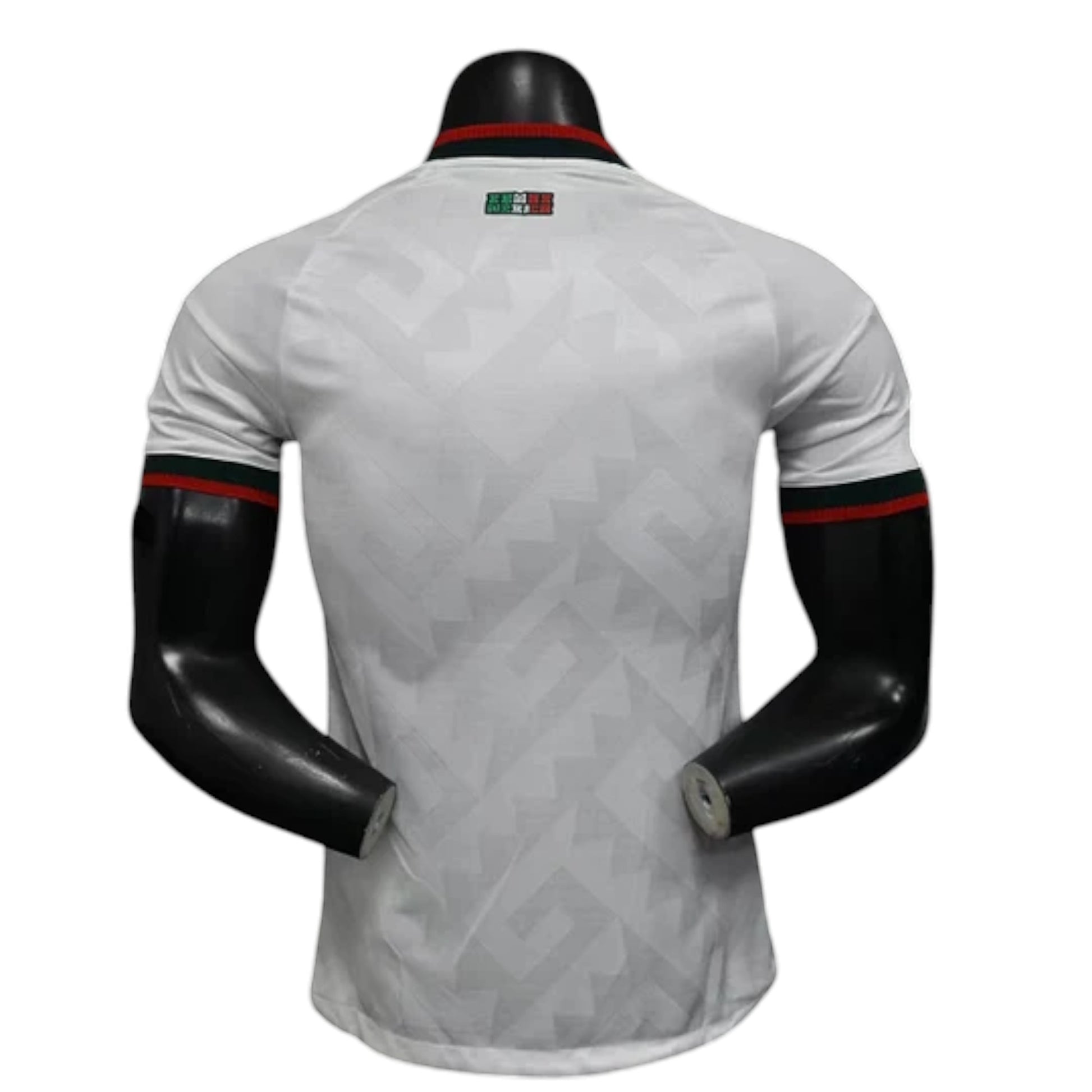 GOATkitz Mexico 2026 player version away jersey, white with green and red trim on collar and sleeves. Geometric pattern.
