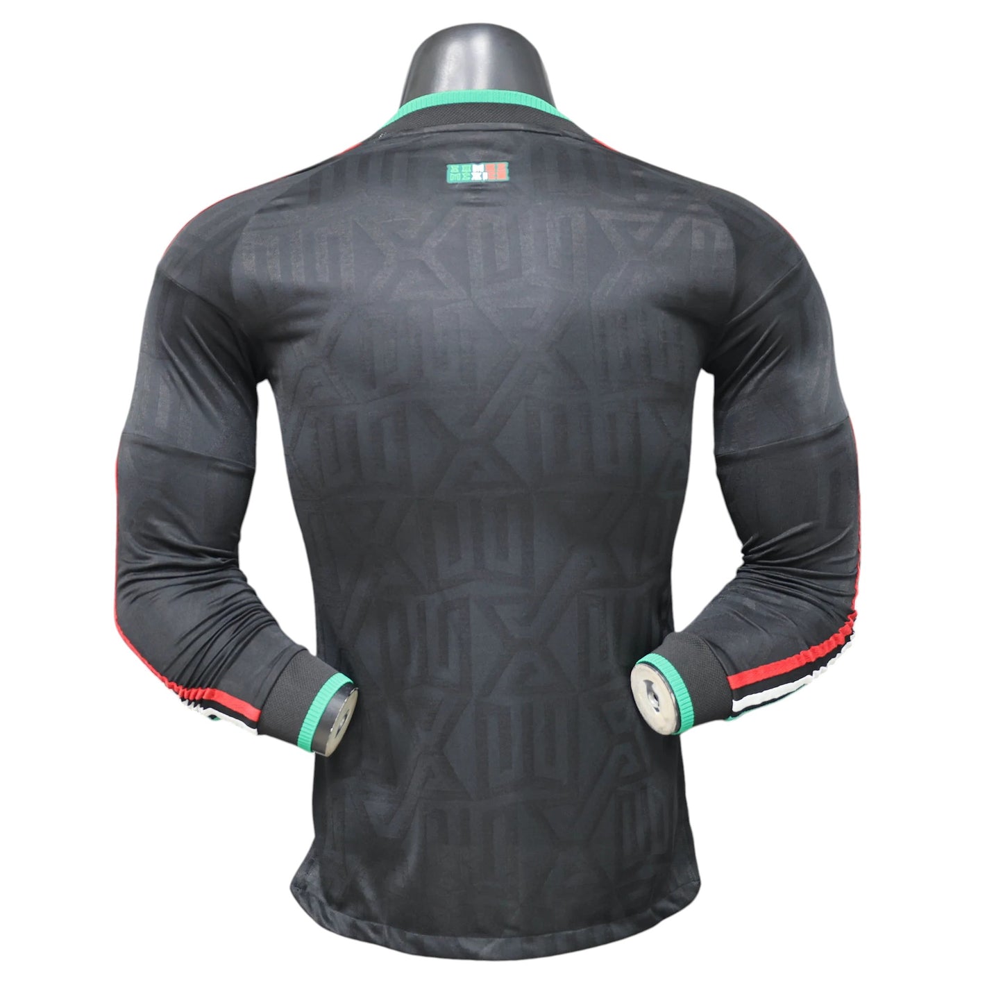 GOATkitz Mexico 2026 black long sleeve player version third jersey with green and red trim on cuffs and collar.