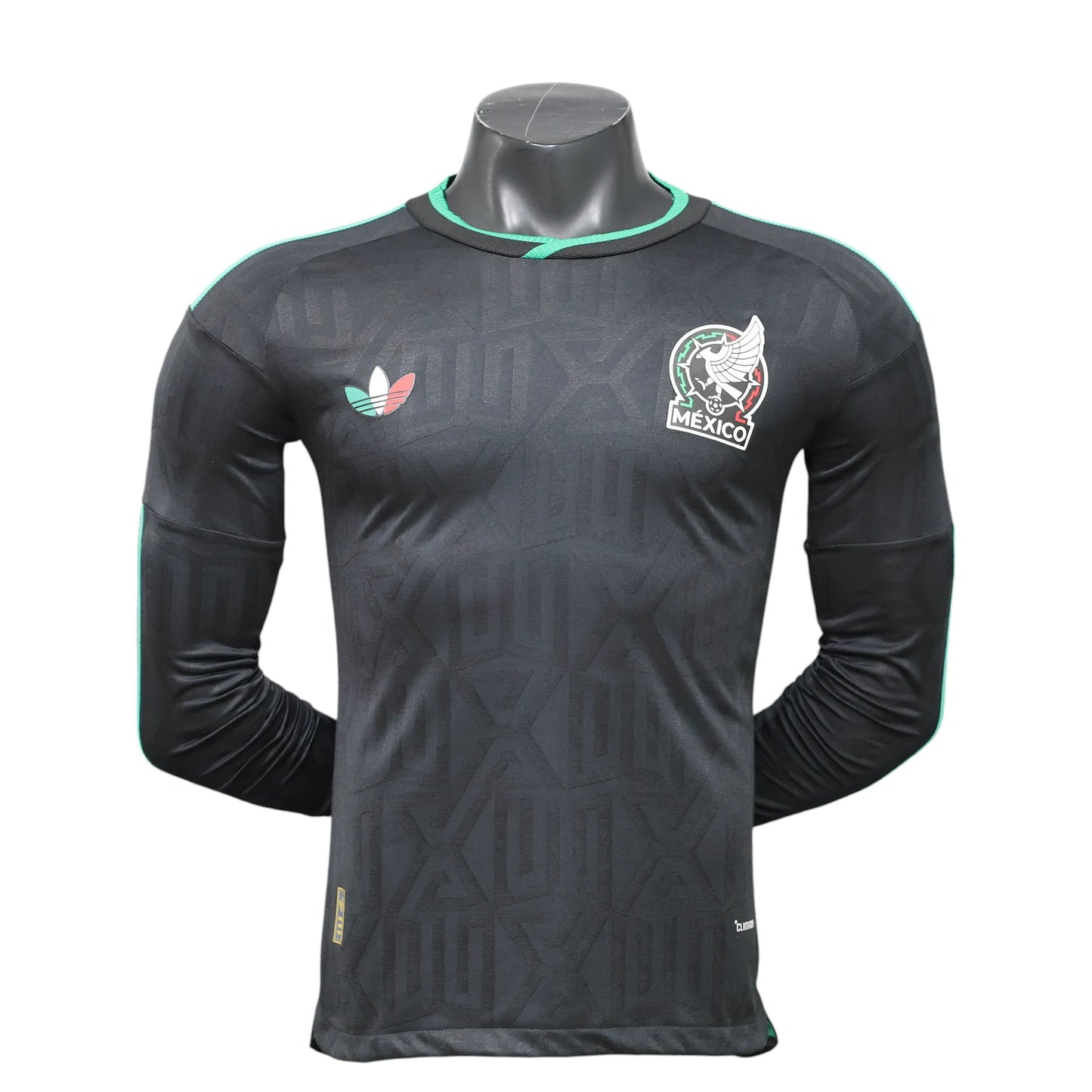 GOATkitz black long sleeve Mexico 2026 player version third jersey with green trim and embossed geometric pattern.