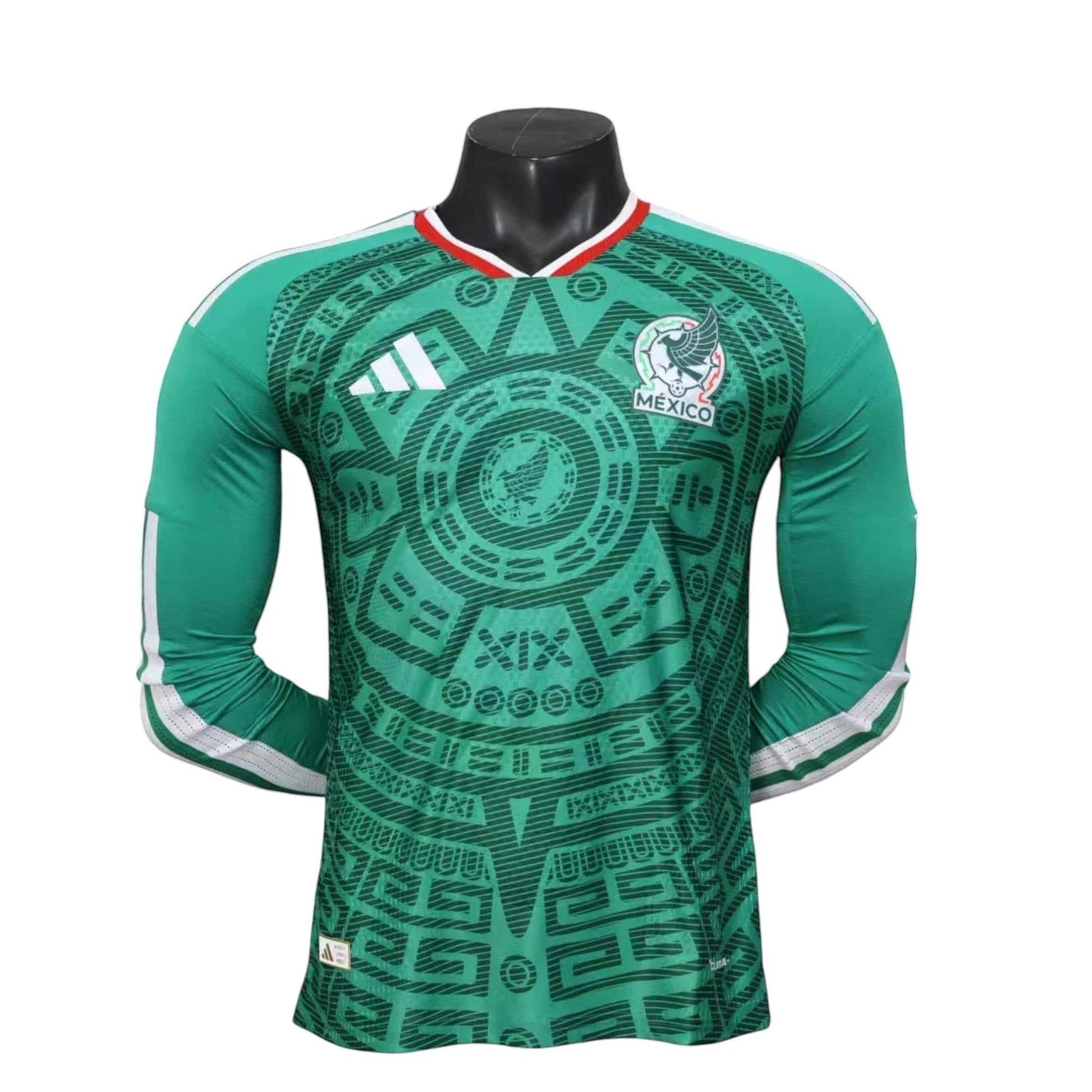 GOATkitz Mexico 2026 long sleeve player version home jersey in green with Aztec-inspired pattern and white Adidas stripes.
