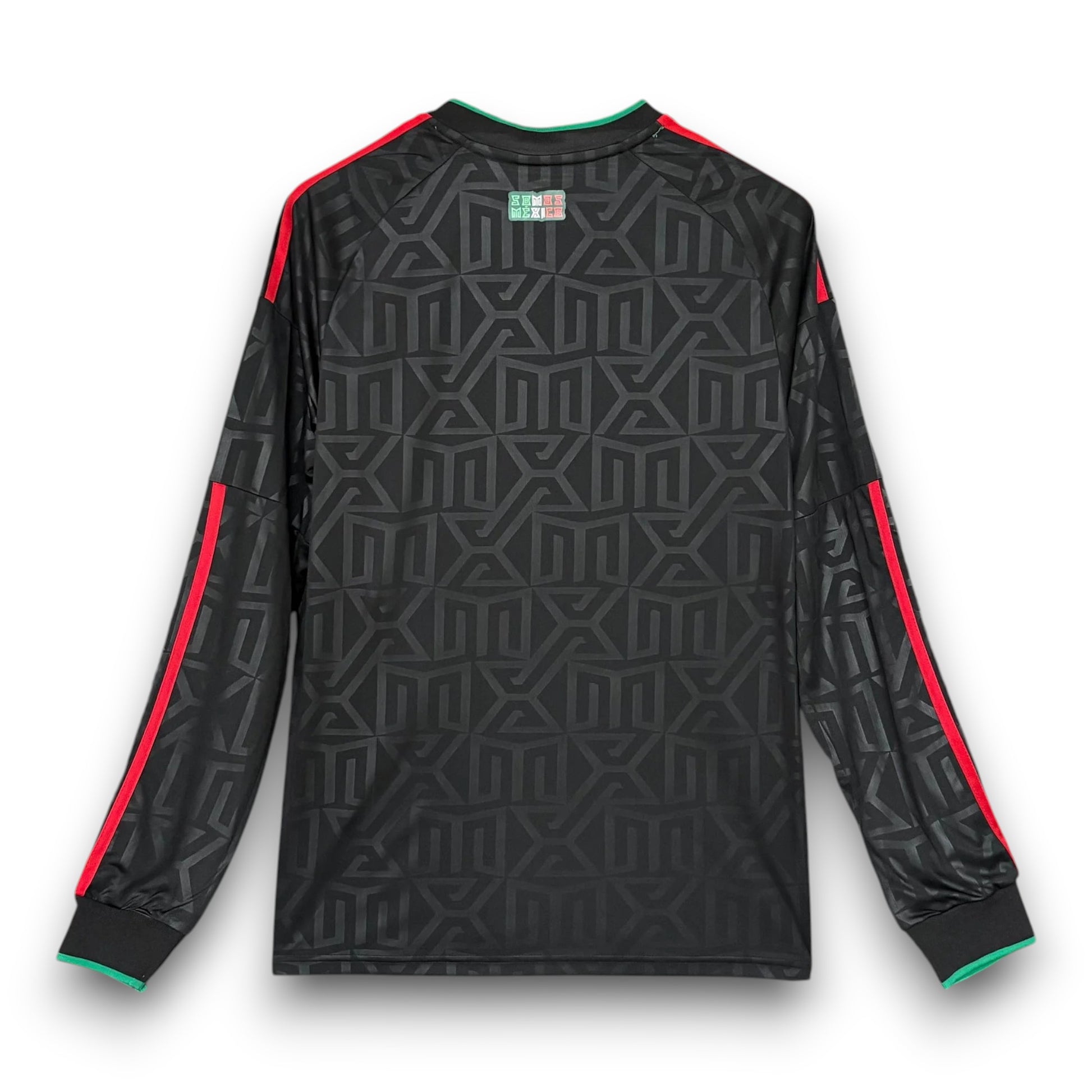 GOATkitz Mexico 2026 long sleeve third jersey in black with a repeating geometric pattern, red and green trim.