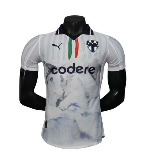 GOATkitz Monterrey 2025 away jersey, white with blue marble print, green and red stripes, and customisable name/number.