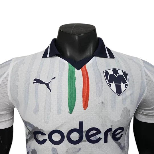 GOATkitz Monterrey 2025 Club World Cup player version away jersey. White with navy collar, green and orange stripes, and team crest.