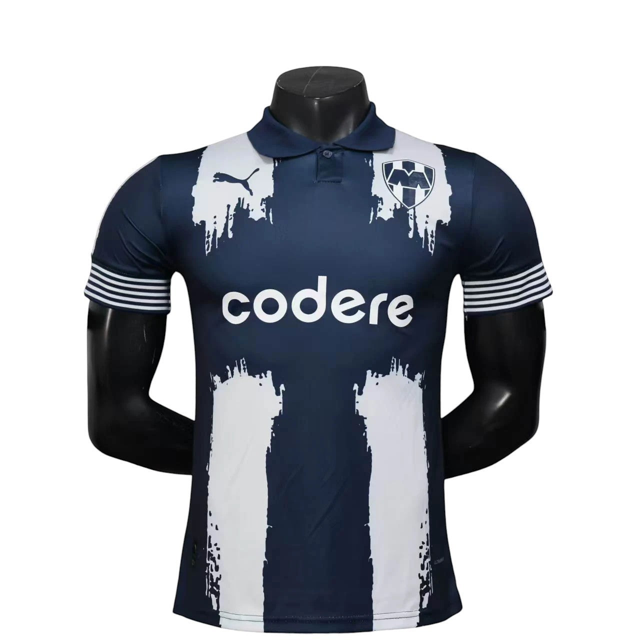 GOATkitz Monterrey 2025 Club World Cup player version home jersey, navy blue with white paint-stroke design and striped cuffs.