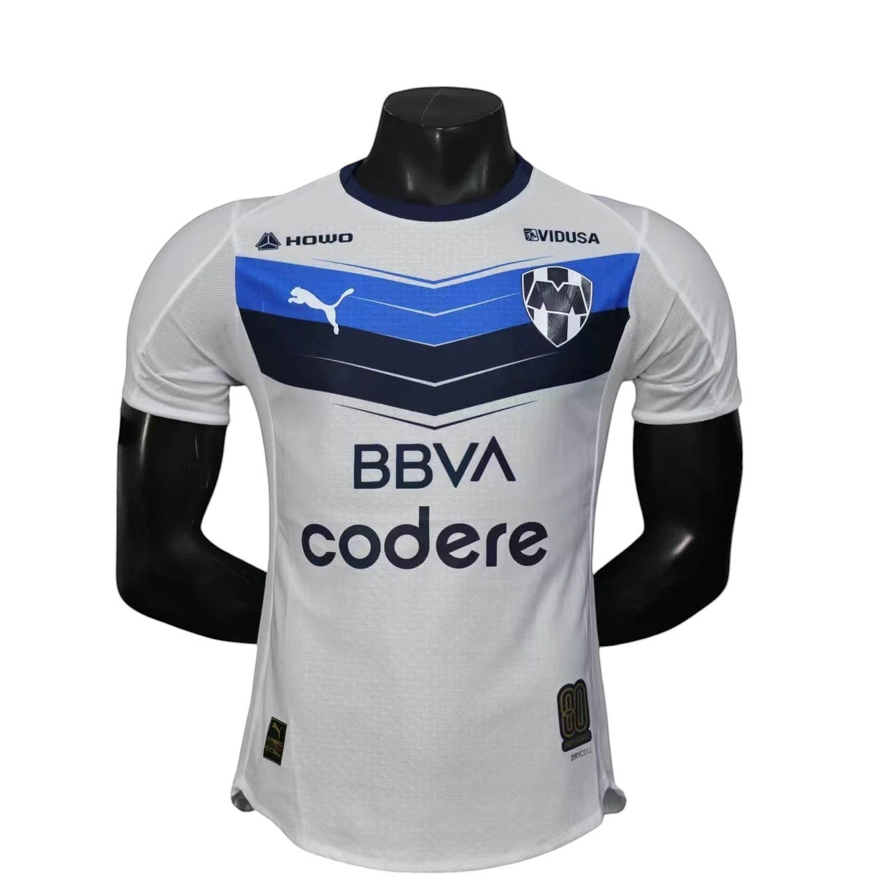 GOATkitz Monterrey 2025-26 player version away jersey in white with blue and navy accents. Features Puma logo, team crest, and sponsor logos.